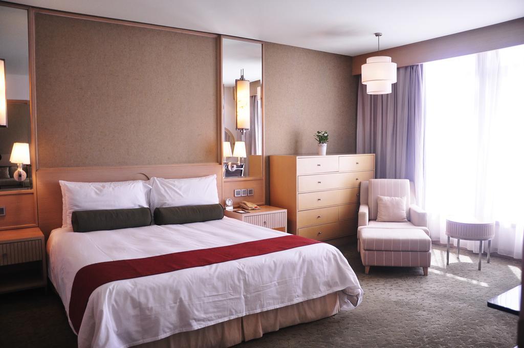 Hotel Nikko Tianjin Eksteriør bilde A bedroom at the hotel