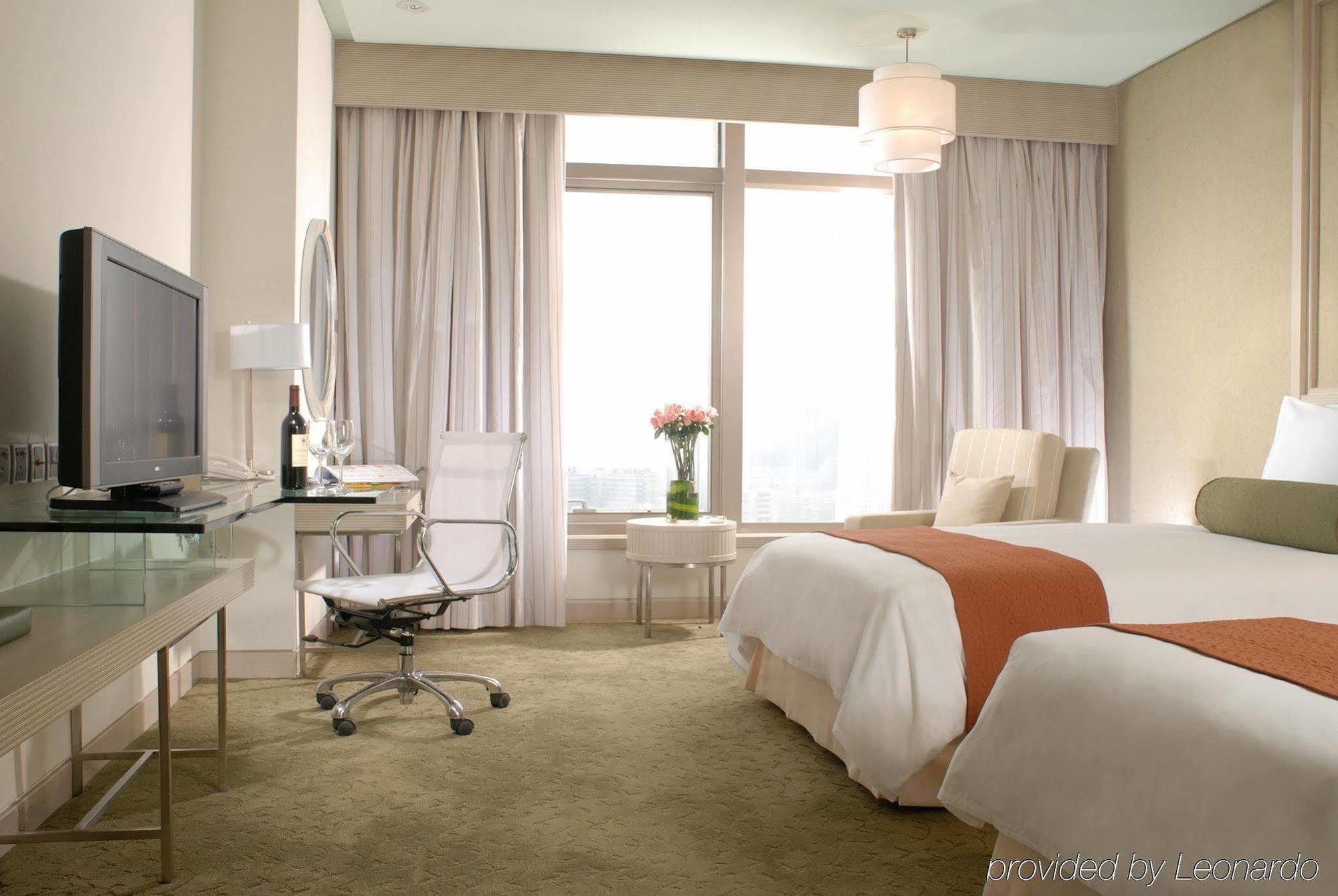 Hotel Nikko Tianjin Rom bilde A room at the hotel